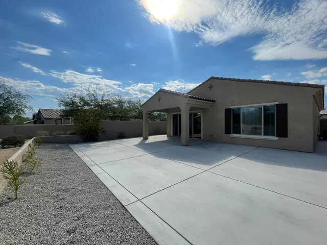 front view of a house with a garden