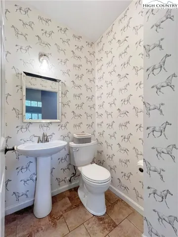 a bedroom with a bed and a ceiling fan