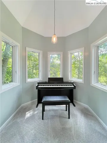 a room with wooden floor and a window