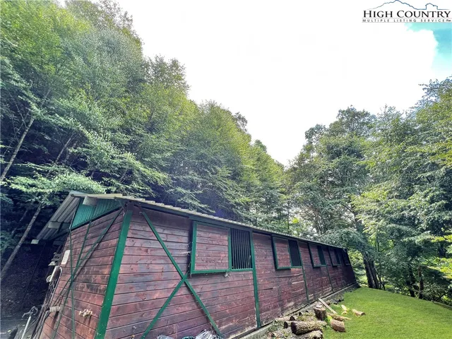 a view of a big yard with lots of green space