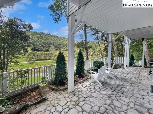 a view of field with trees in the background