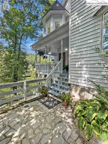 a view of a big yard with lots of green space
