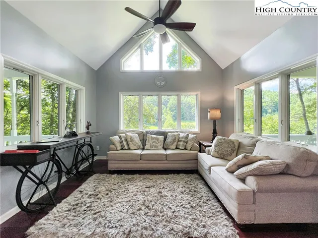 a large living room with hard wood floors