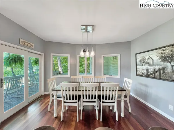 a kitchen with granite countertop kitchen island wooden floors cabinets and center island