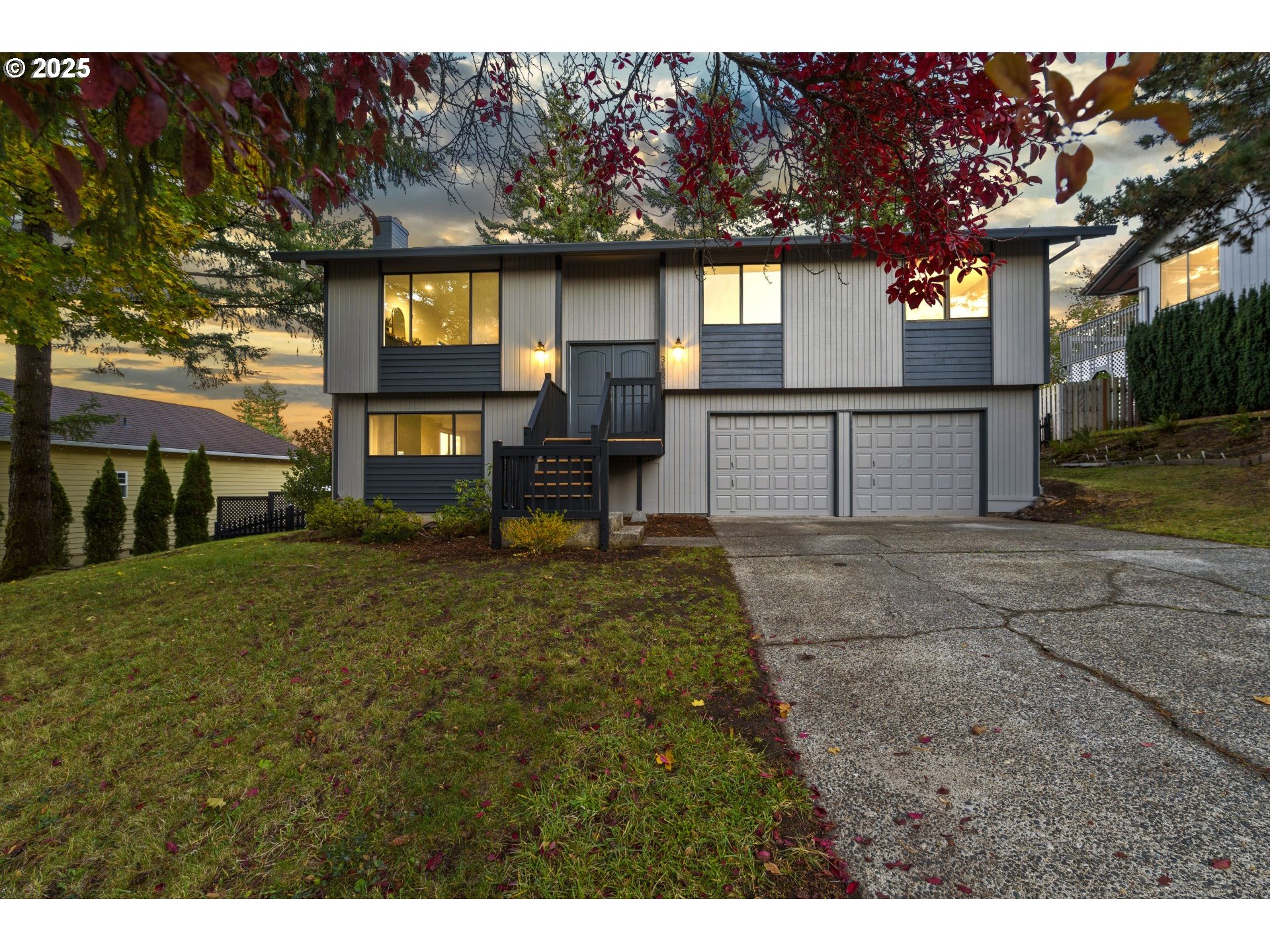 a view of a house with yard and sitting area