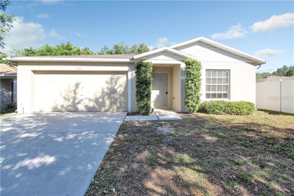 2032 Stoneview Road Odessa, FL 33556 - Photo 1 of 1 a view of a house with backyard and garden