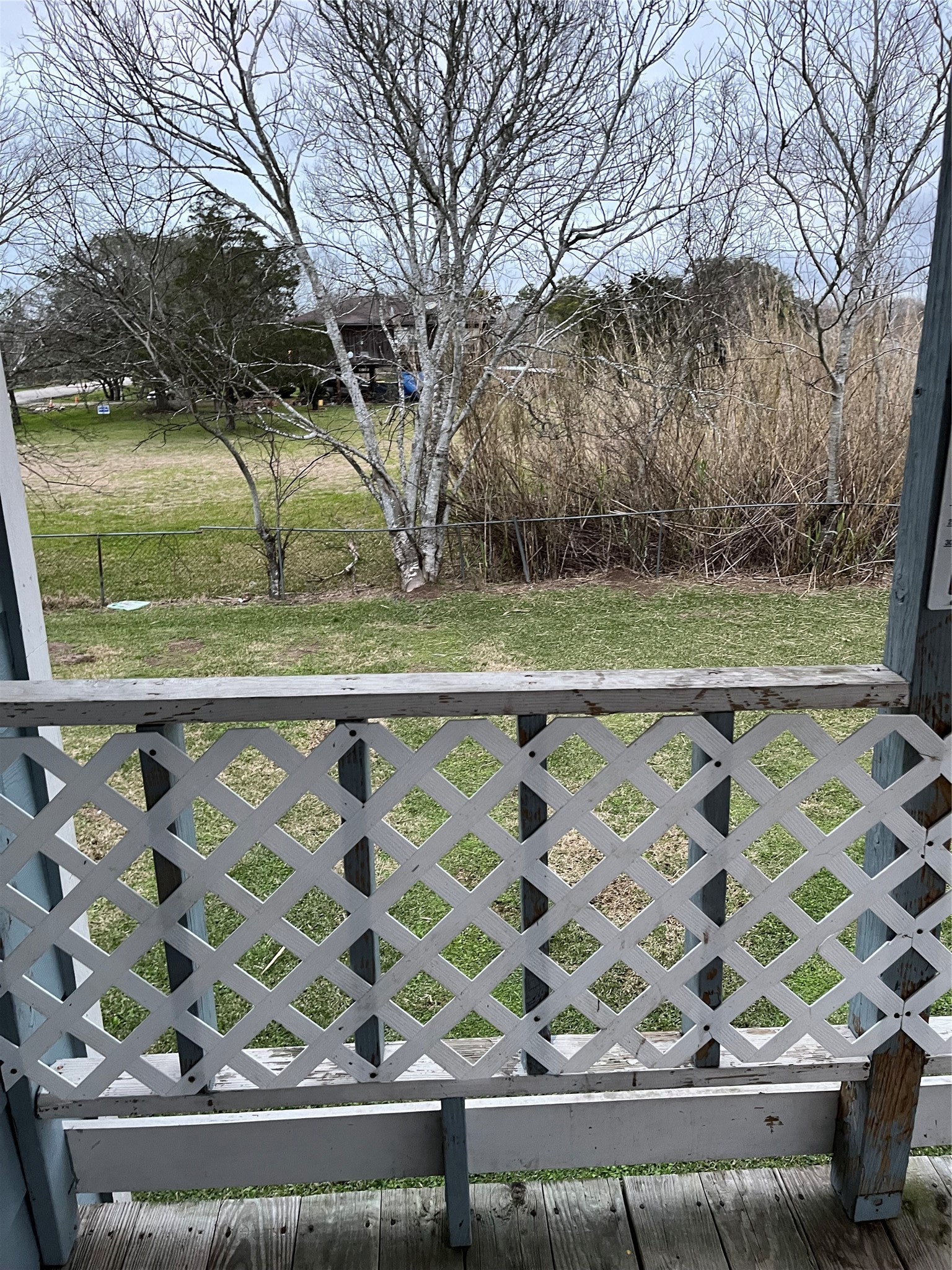 12022 Annette Road, Unit CR657 Angleton, TX 77515 - Photo 10 of 26 a view of a wooden floor and a yard