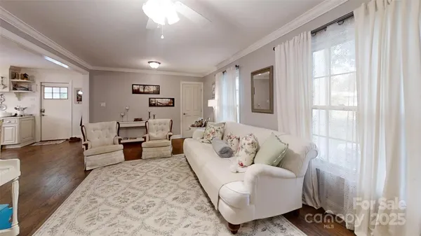 a view of a dining room with furniture and window
