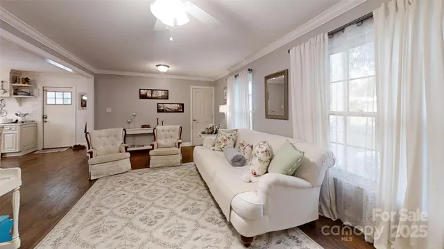 a view of a dining room with furniture and window
