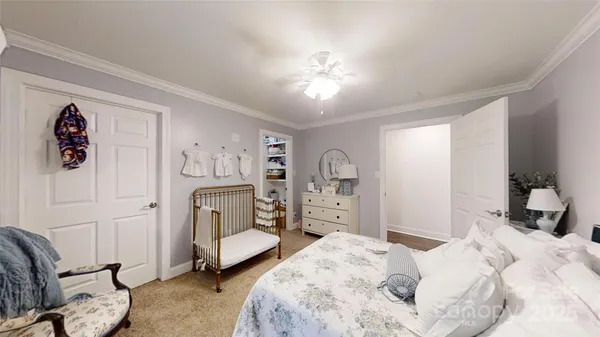 a bed room with a bed and a chandelier