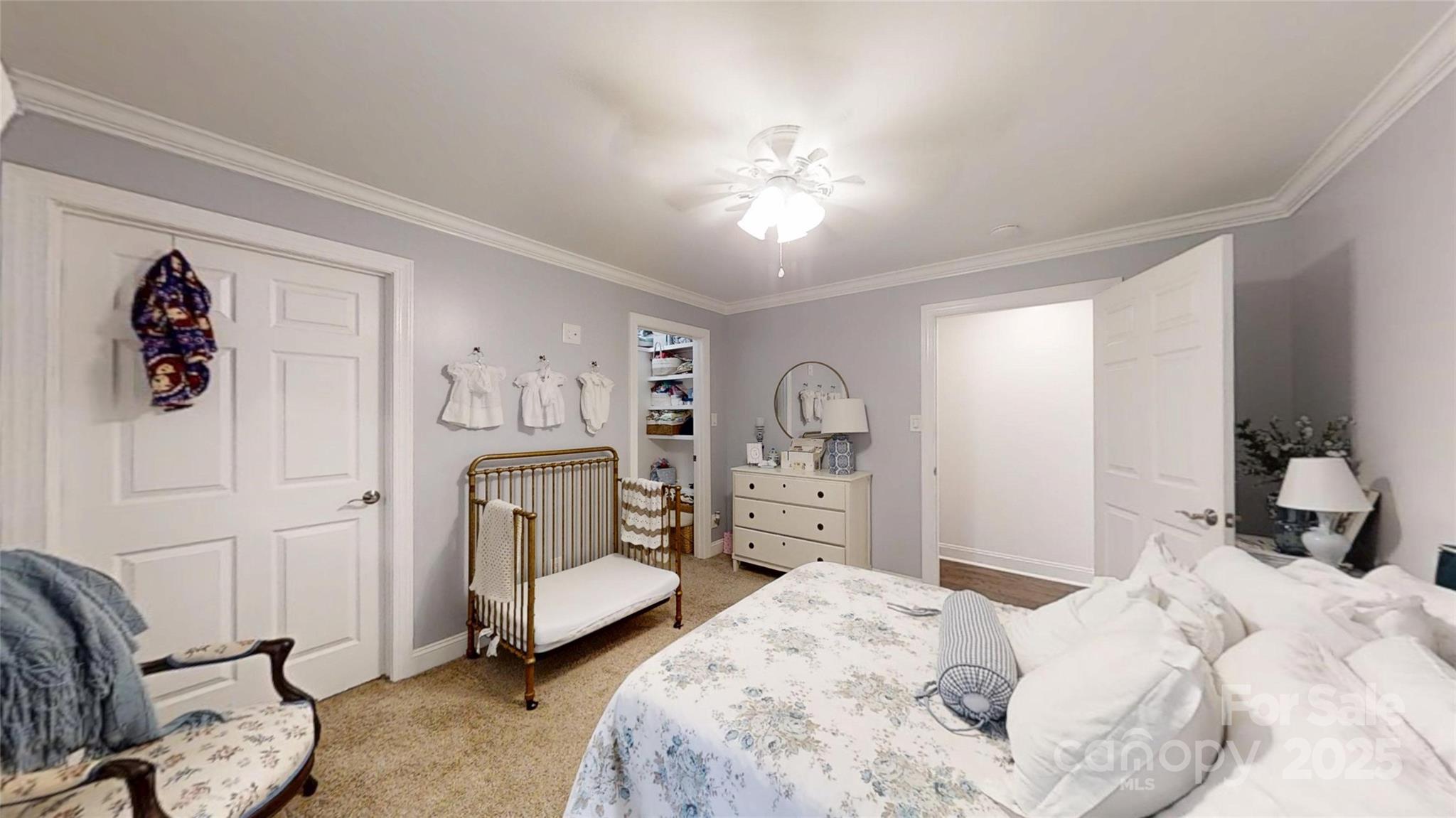 5298 Hoover Elmore Road Vale, NC 28168 - Photo 15 of 29 a bedroom with a bed and a chandelier