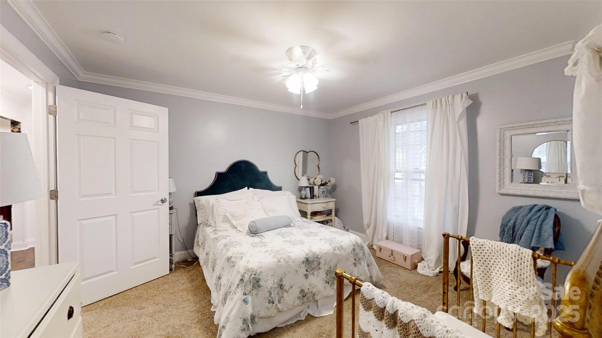 5298 Hoover Elmore Road Vale, NC 28168 - Photo 16 of 29 a bed room with a bed and a chandelier