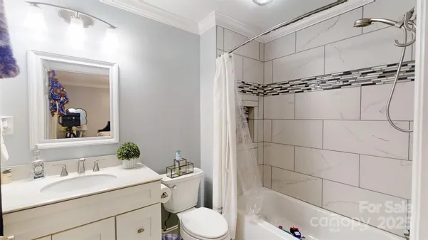 a utility room with sink dryer and washer