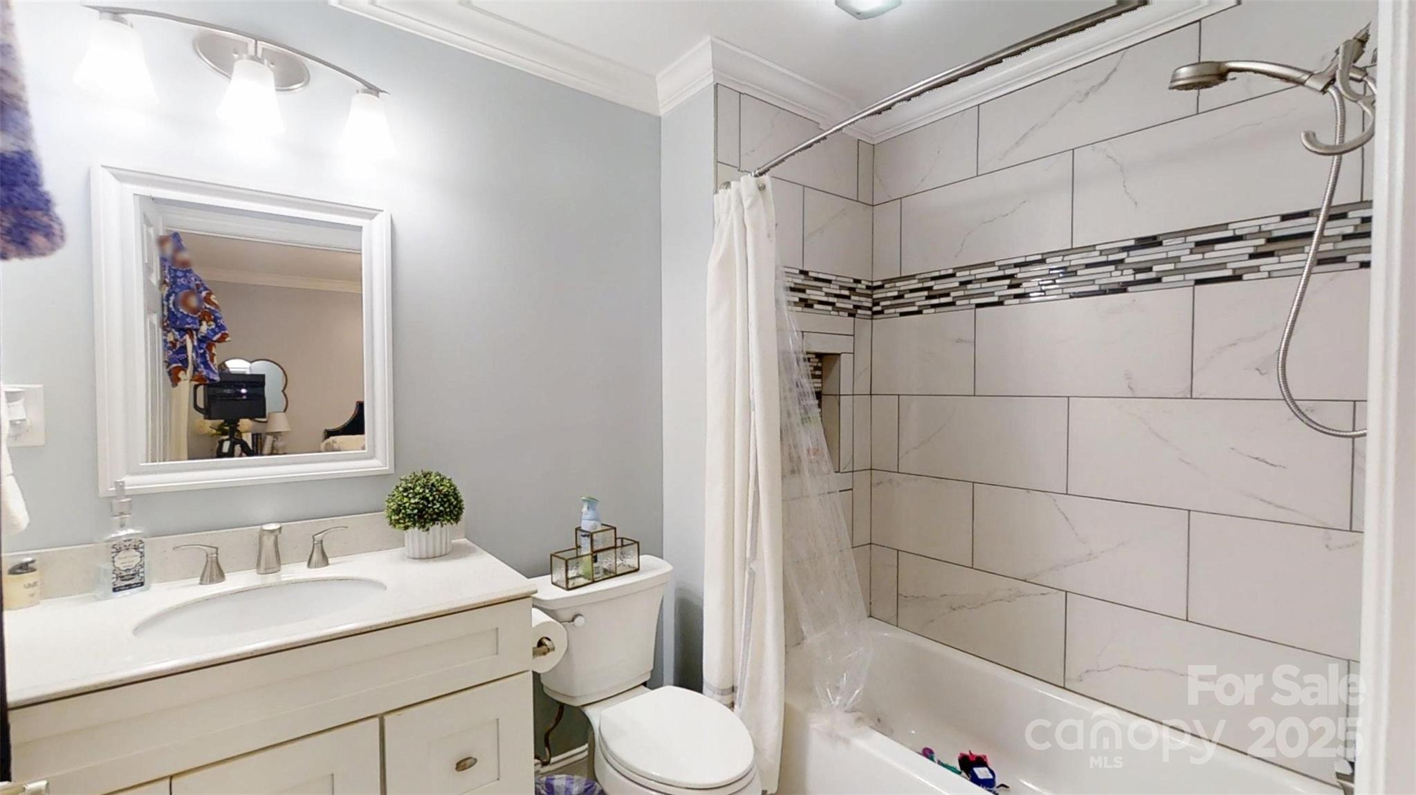 5298 Hoover Elmore Road Vale, NC 28168 - Photo 17 of 29 a bathroom with a granite countertop sink toilet a mirror a vanity and shower