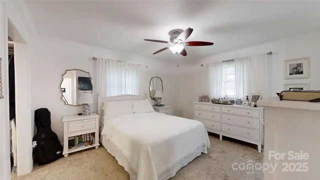 a view of walk in closet with clothes