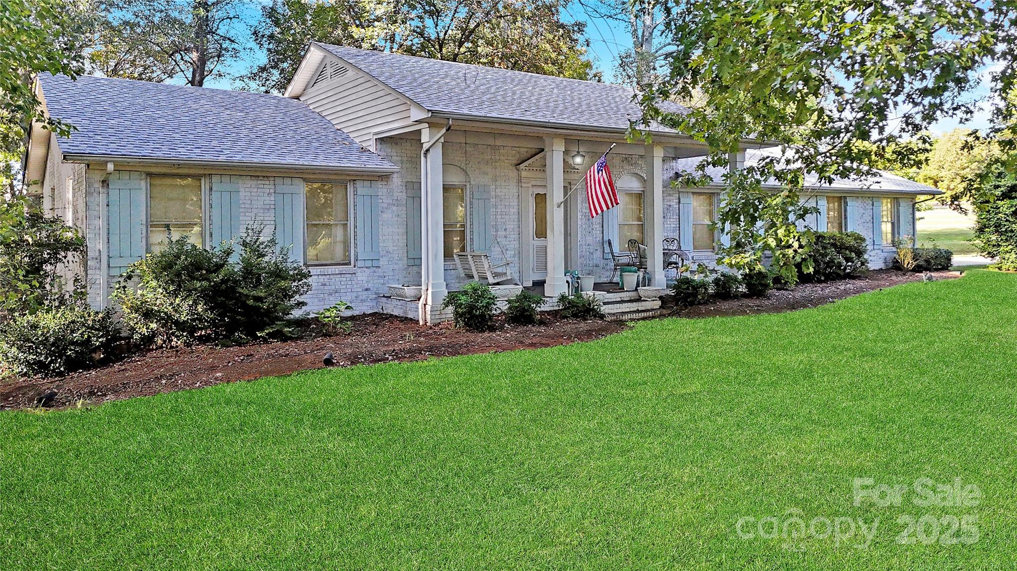 5298 Hoover Elmore Road Vale, NC 28168 - Photo 2 of 29 a front view of a house with a garden and plants