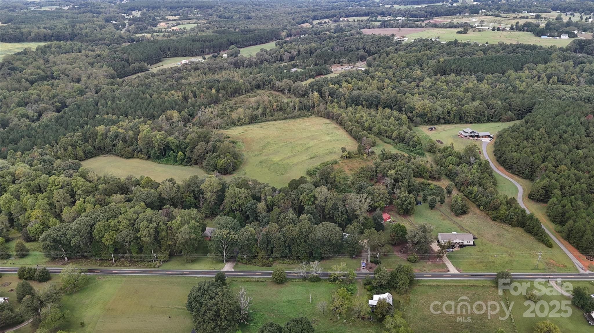 5298 Hoover Elmore Road Vale, NC 28168 - Photo 24 of 29 an aerial view of residential houses with outdoor space and trees