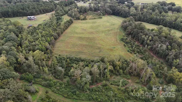 a kitchen with stainless steel appliances granite countertop a refrigerator a sink a stove and island