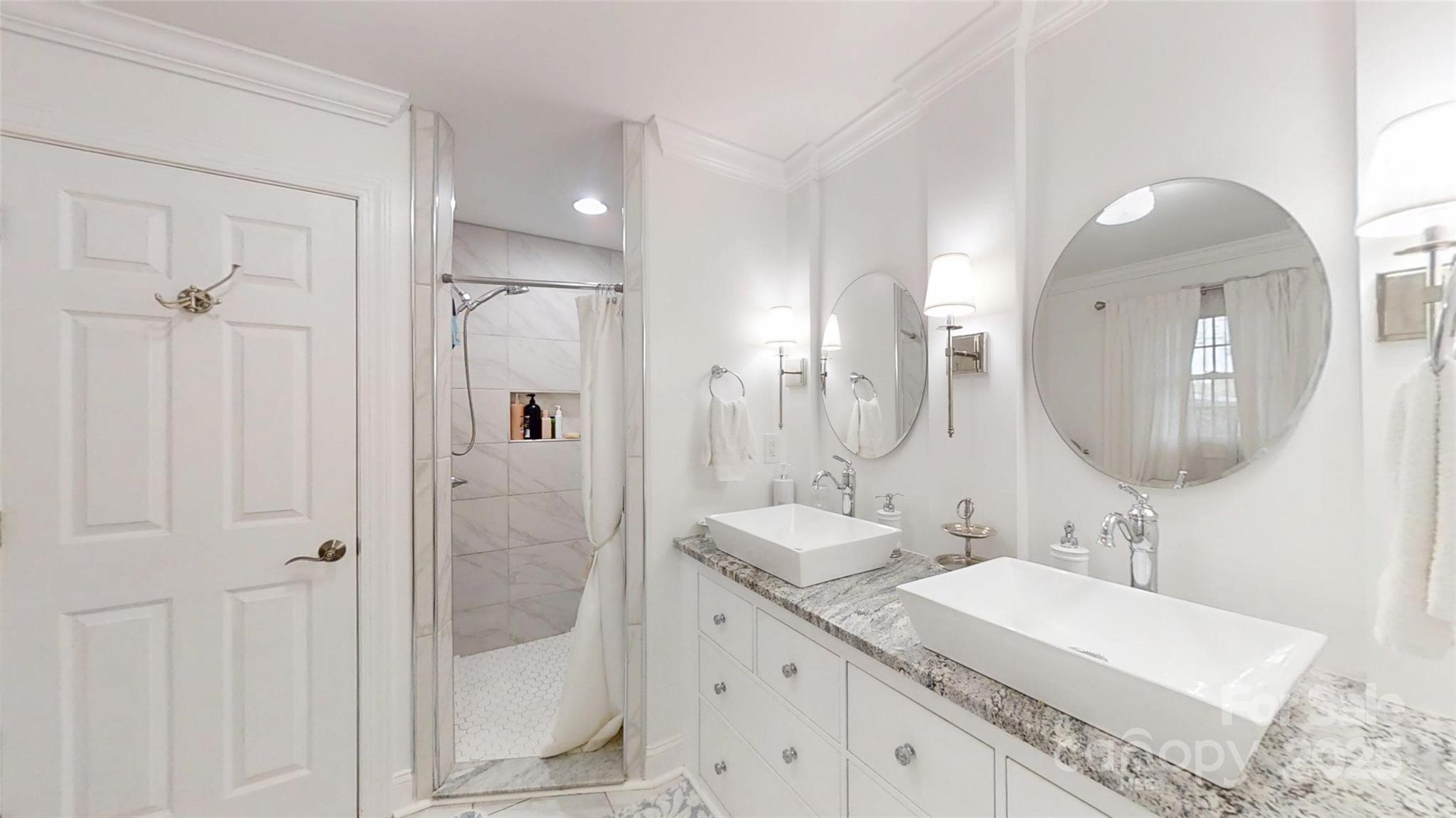 5298 Hoover Elmore Road Vale, NC 28168 - Photo 5 of 29 a bathroom with a granite countertop sink a shower a mirror and vanity