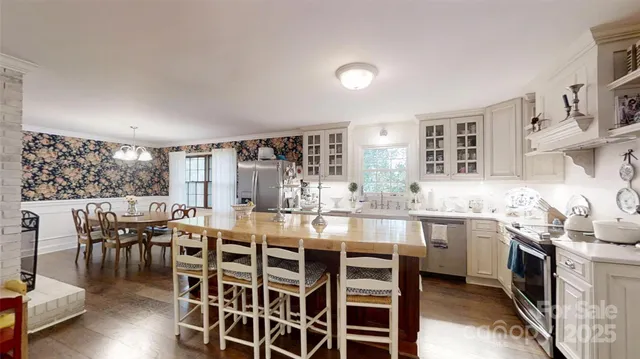 a very nice looking dining room with furniture