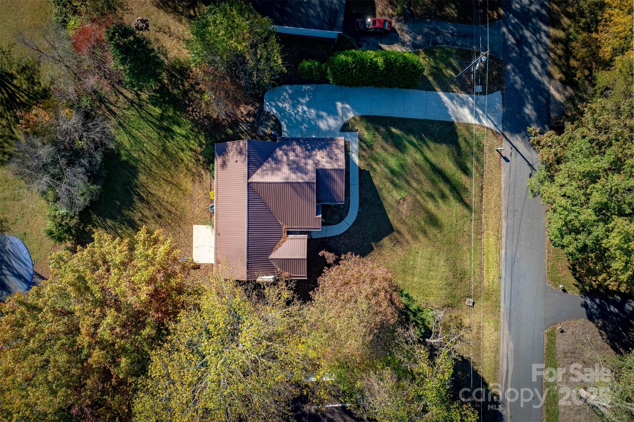 2693 Farmland Acrs Road Morganton, NC 28655 - Photo 13 of 33 a view of a house with a small yard and sitting area