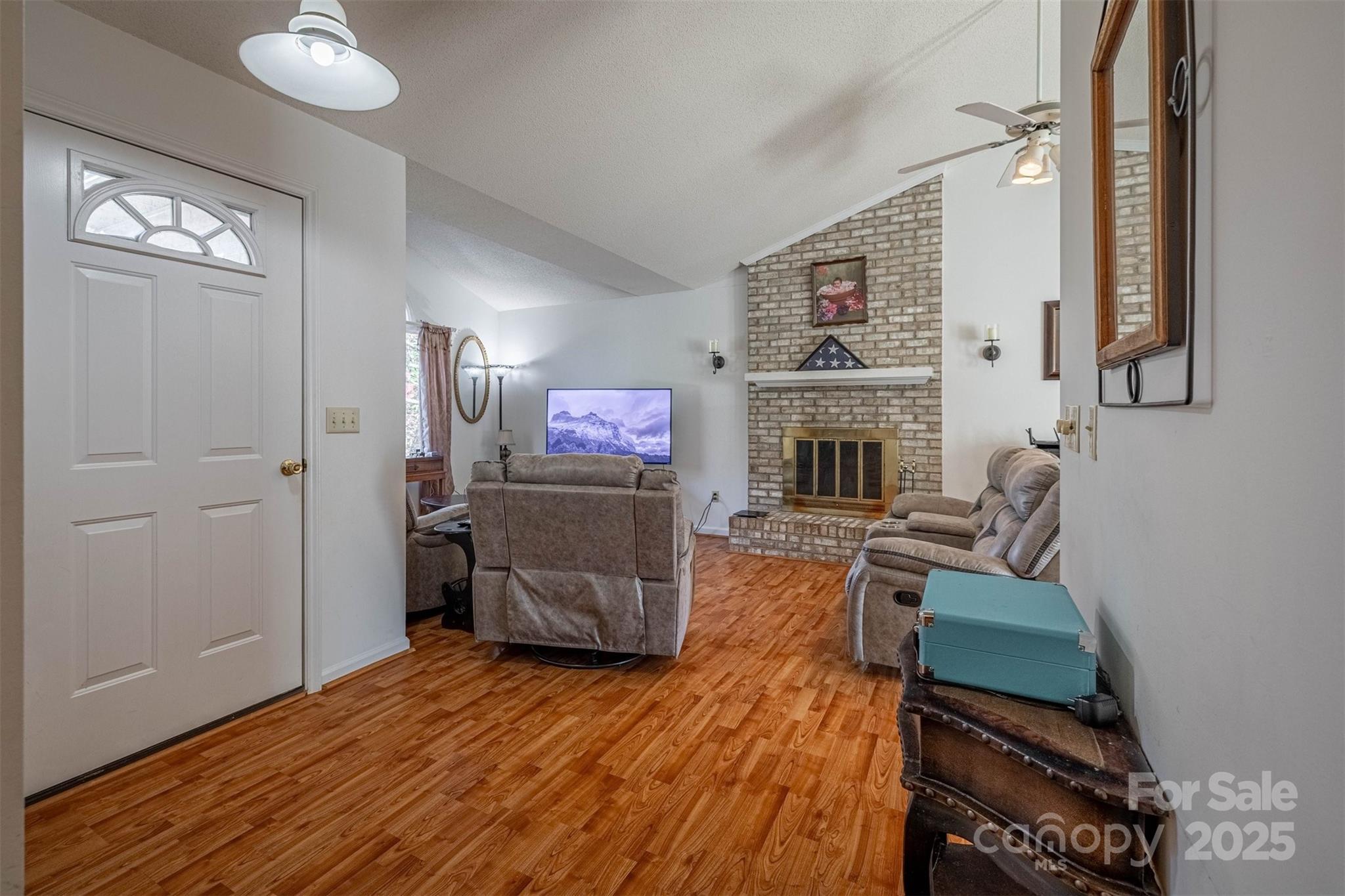 2693 Farmland Acrs Road Morganton, NC 28655 - Photo 14 of 33 a living room with furniture and a fireplace