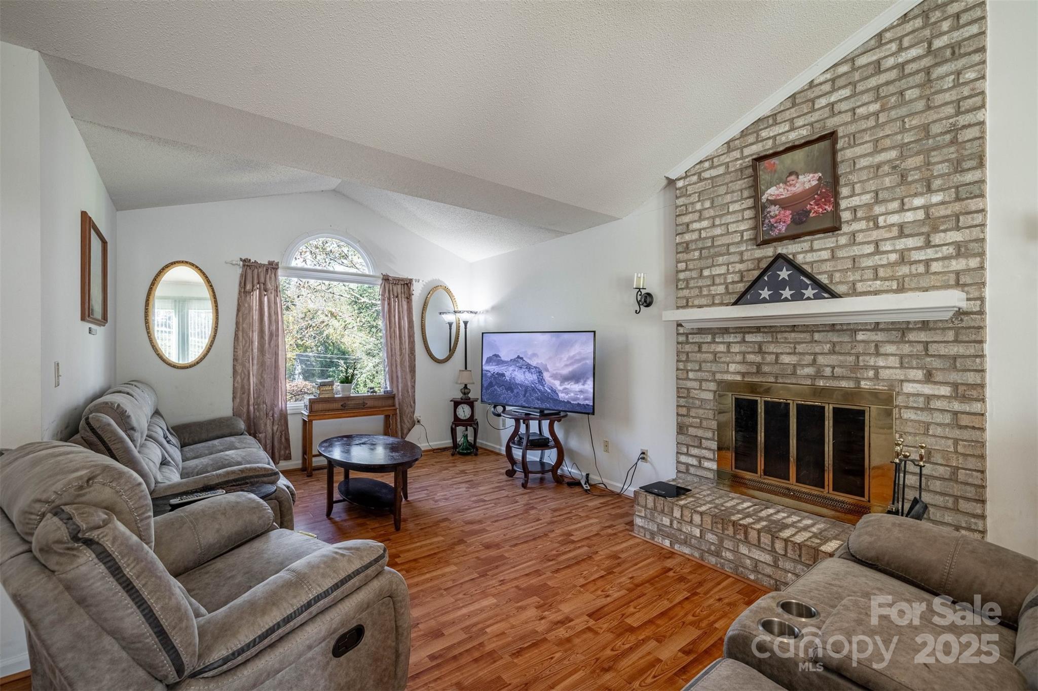 2693 Farmland Acrs Road Morganton, NC 28655 - Photo 15 of 33 a living room with furniture a fireplace and window