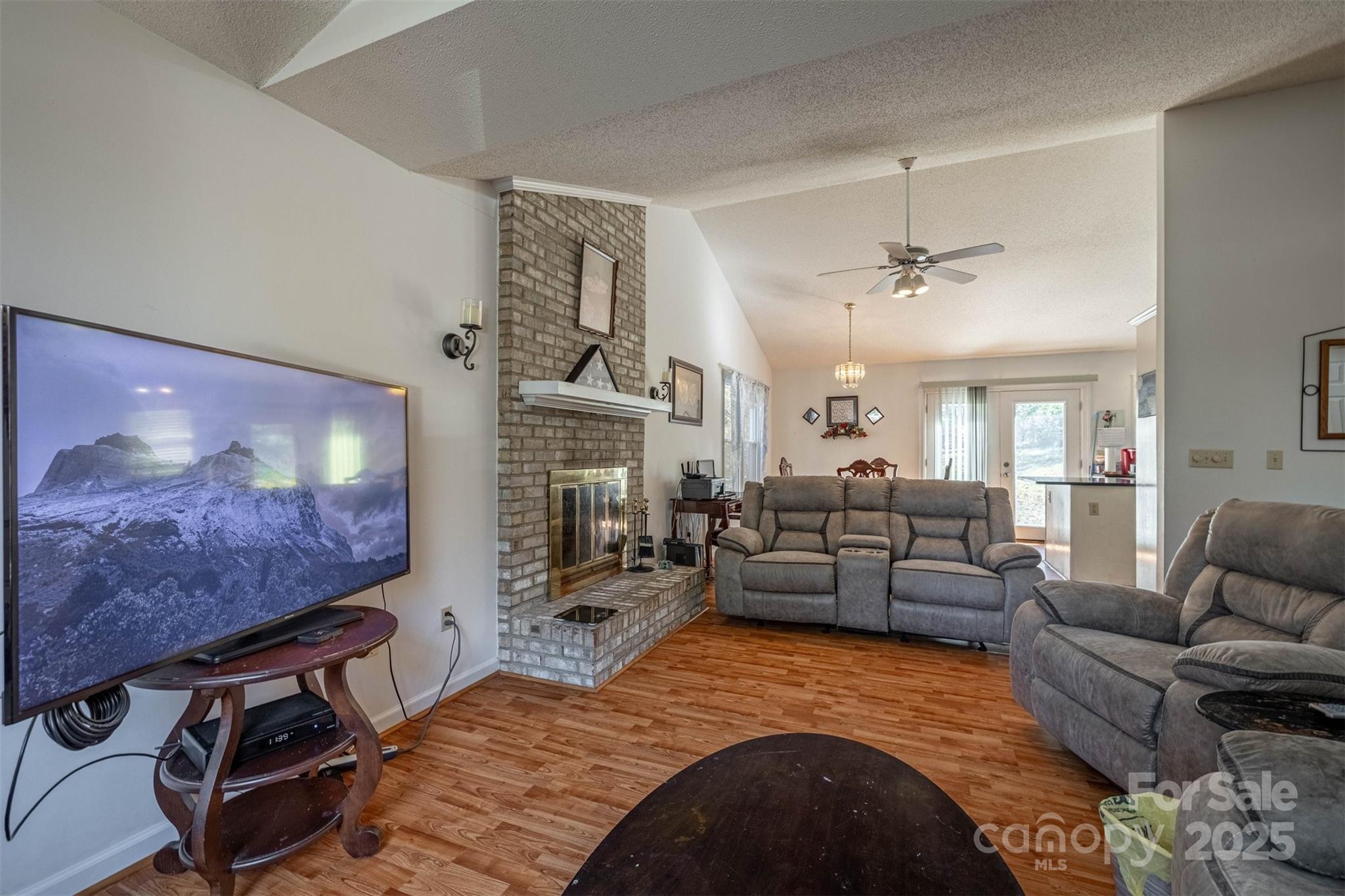 2693 Farmland Acrs Road Morganton, NC 28655 - Photo 16 of 33 a living room with furniture and a fireplace