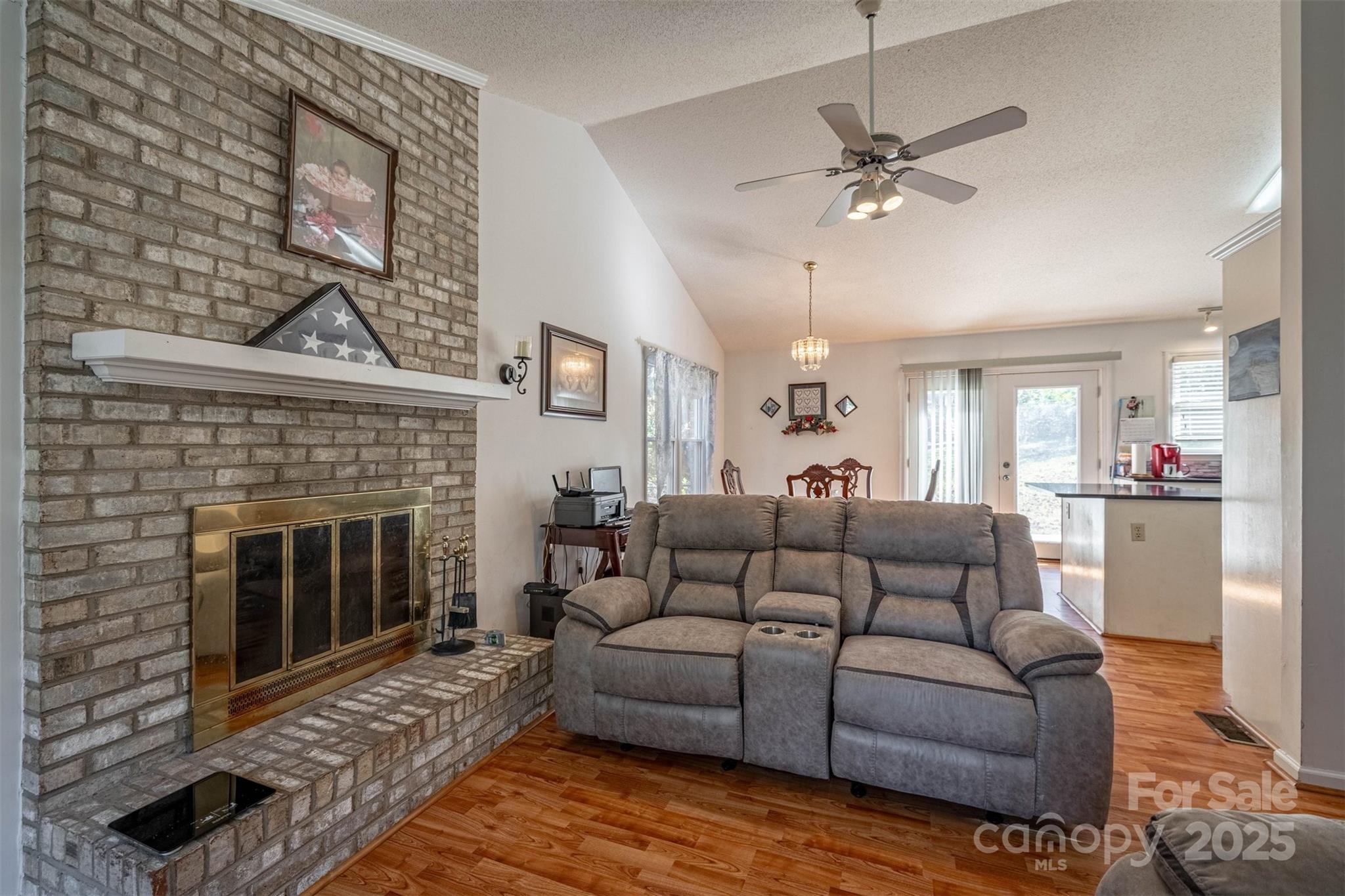 2693 Farmland Acrs Road Morganton, NC 28655 - Photo 17 of 33 a living room with furniture and a fireplace