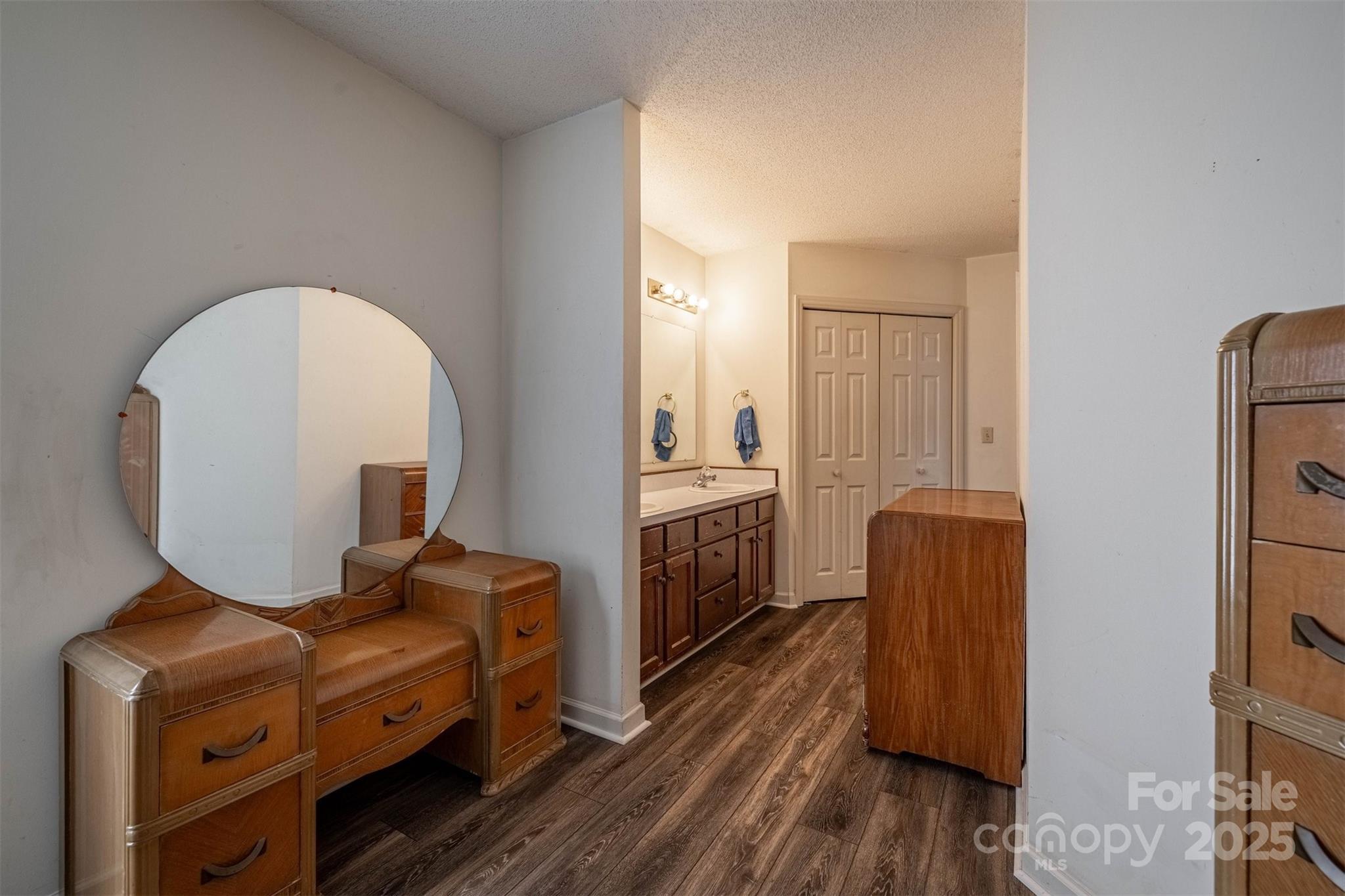 2693 Farmland Acrs Road Morganton, NC 28655 - Photo 23 of 33 a room with furniture a mirror and wooden floor