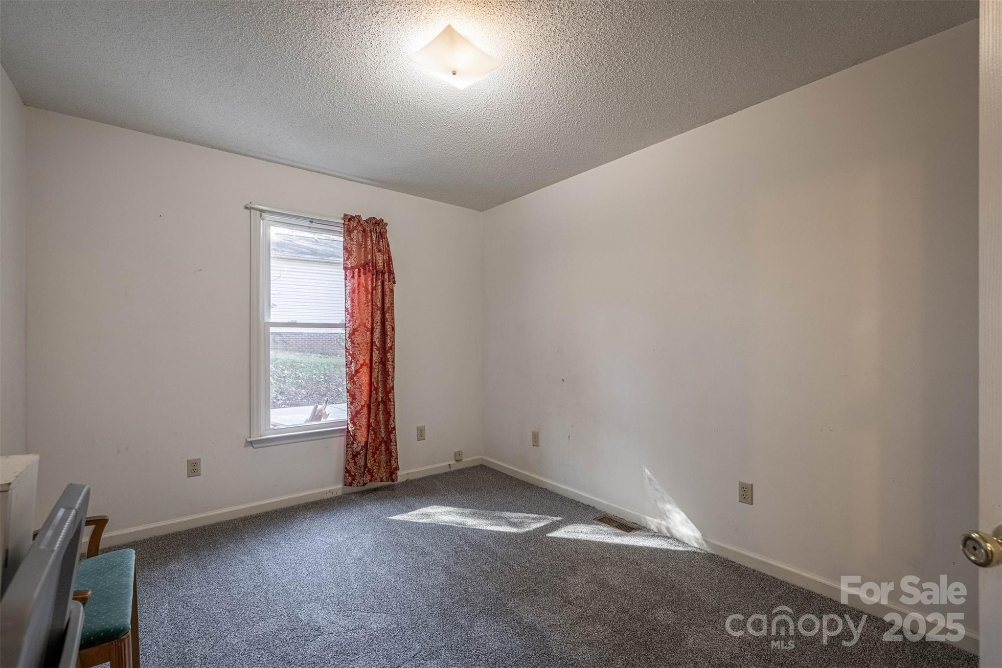 2693 Farmland Acrs Road Morganton, NC 28655 - Photo 27 of 33 an empty room with a window
