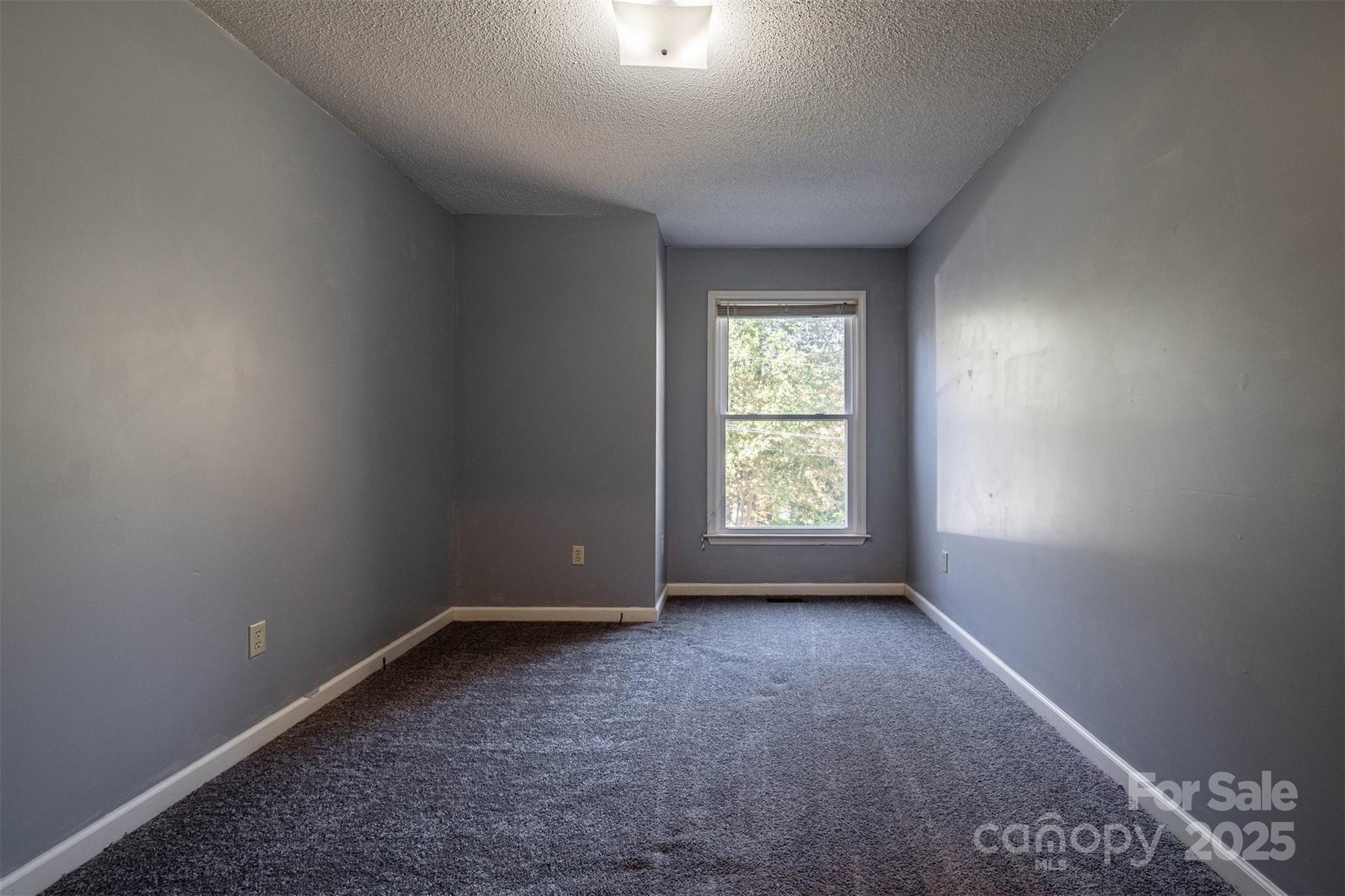 2693 Farmland Acrs Road Morganton, NC 28655 - Photo 30 of 33 an empty room with a window