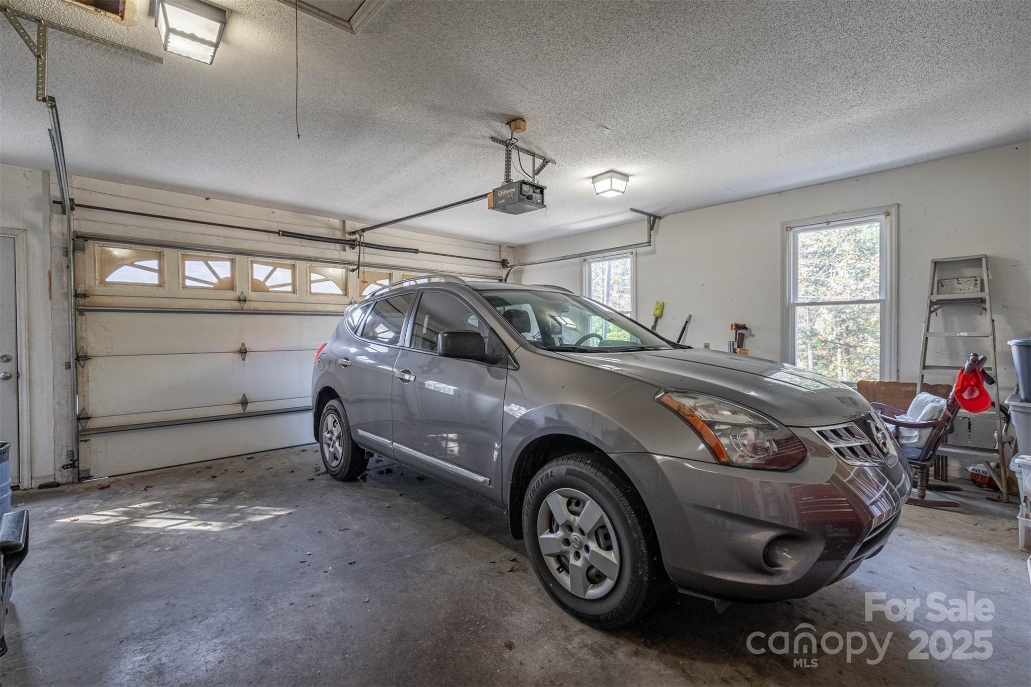 2693 Farmland Acrs Road Morganton, NC 28655 - Photo 32 of 33 a car parked in a garage