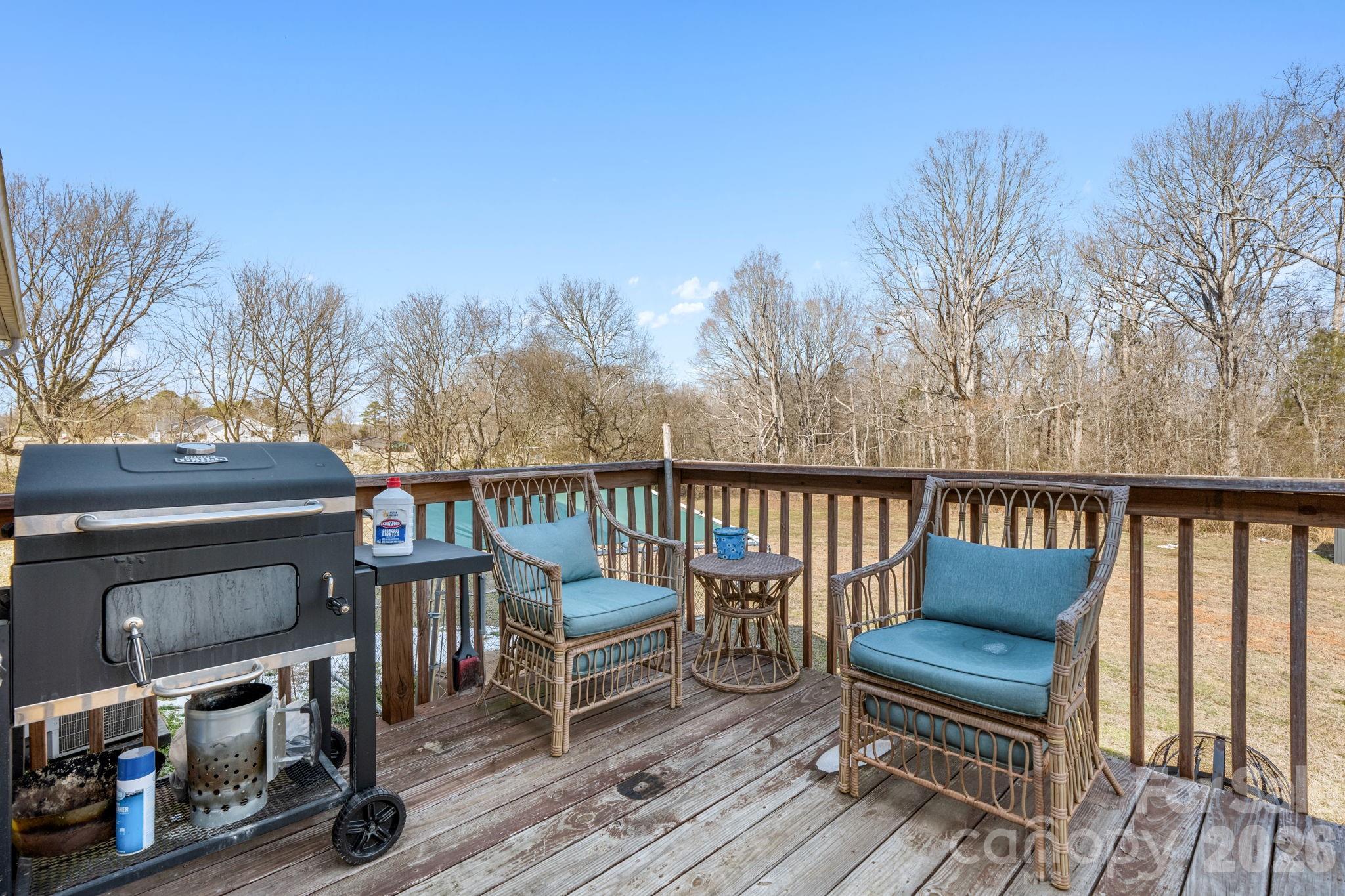2388 Cat Square Road Vale, NC 28168 - Photo 16 of 24 a balcony with wooden floor table and chairs