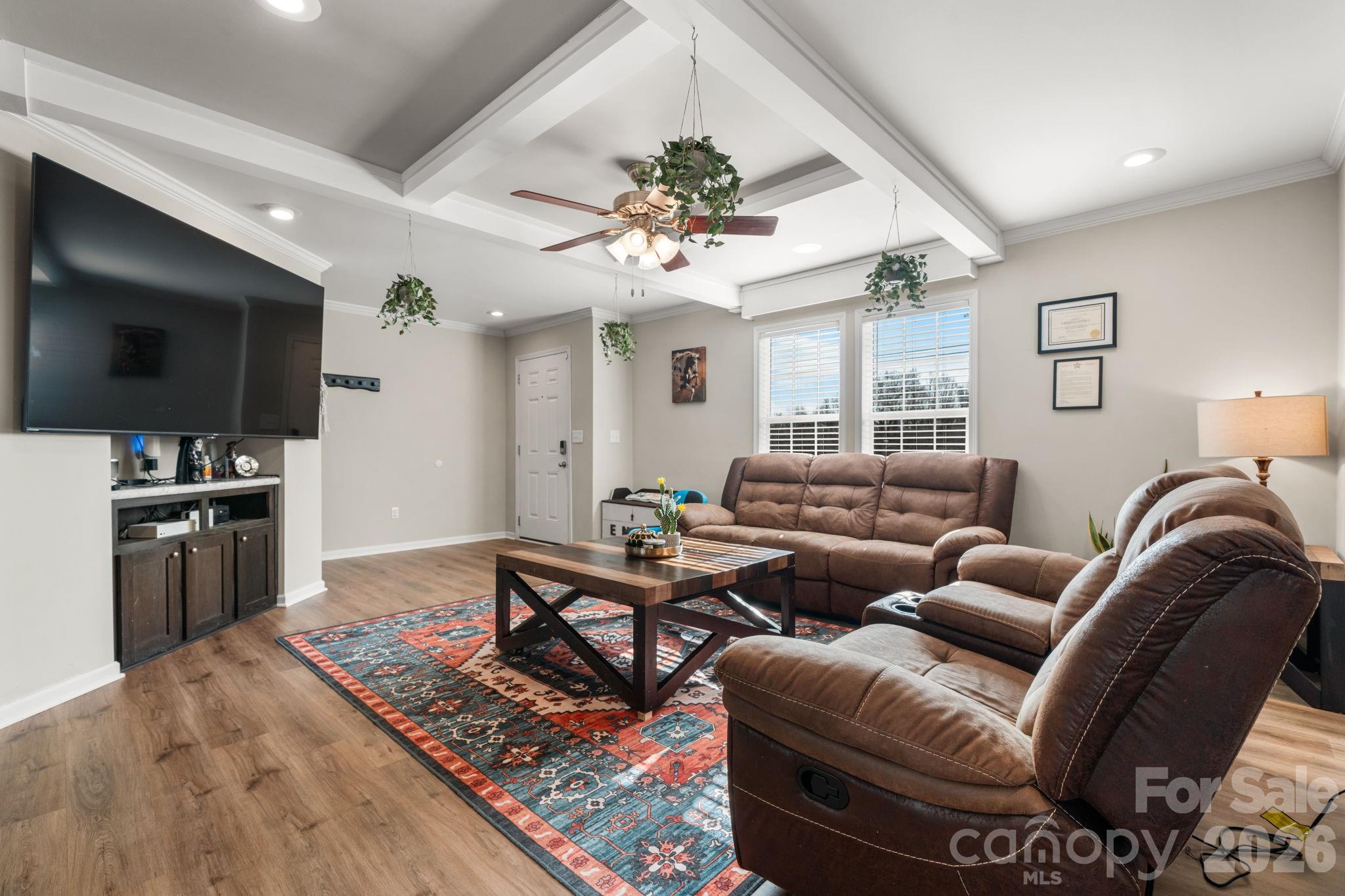 2388 Cat Square Road Vale, NC 28168 - Photo 3 of 24 a living room with furniture a flat screen tv and kitchen view