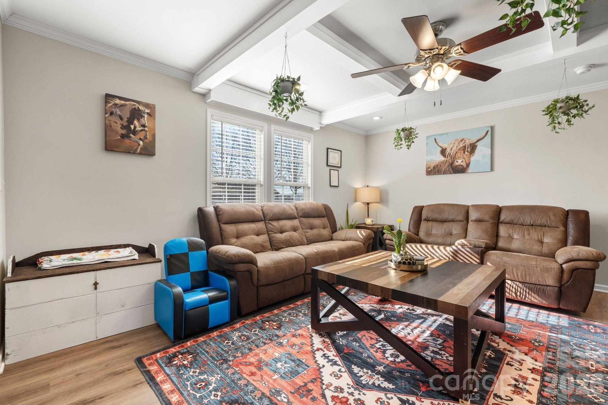 2388 Cat Square Road Vale, NC 28168 - Photo 4 of 24 a living room with furniture a chandelier and a rug