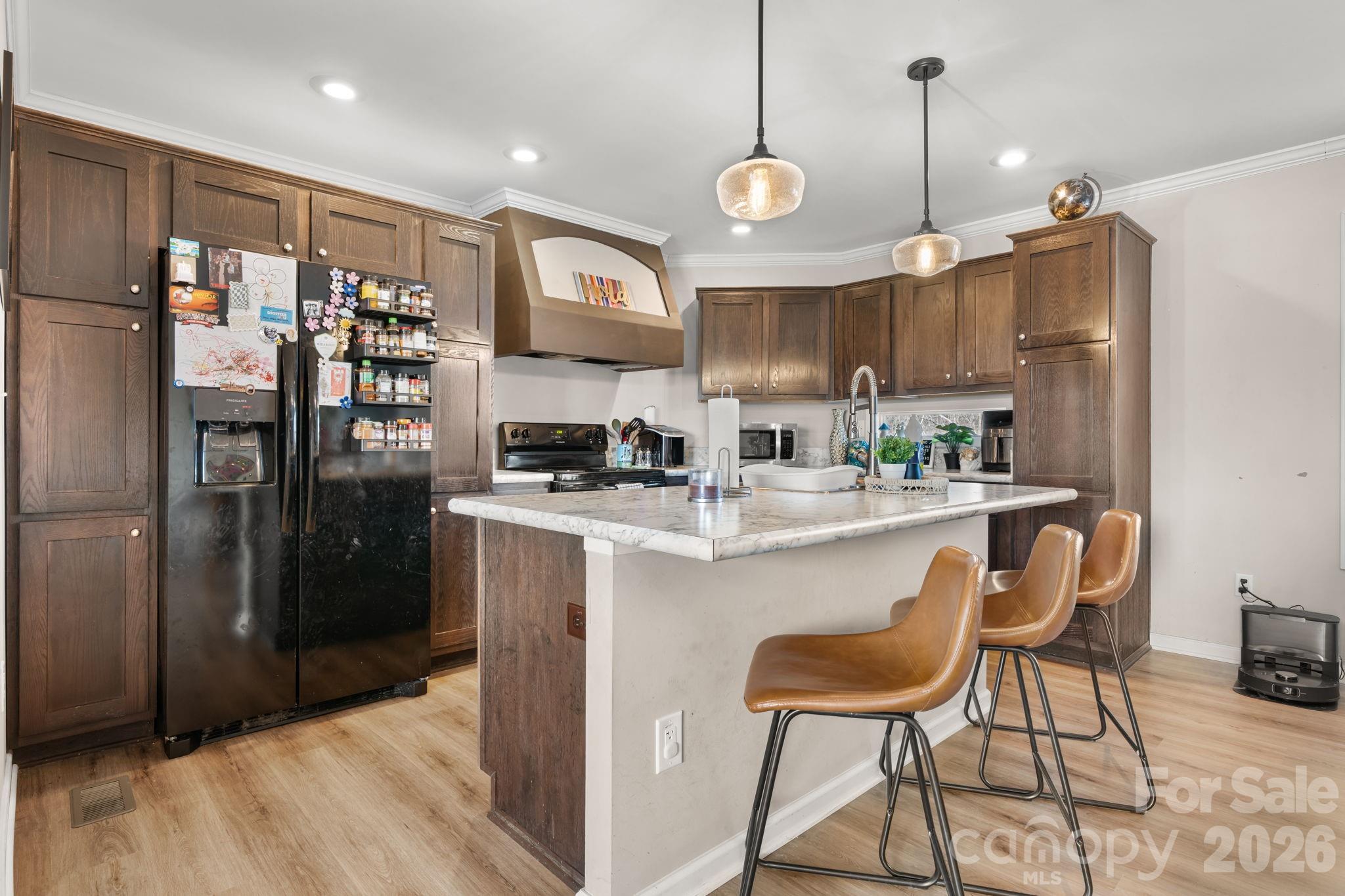2388 Cat Square Road Vale, NC 28168 - Photo 5 of 24 a kitchen with stainless steel appliances granite countertop a refrigerator a stove a sink and a chairs