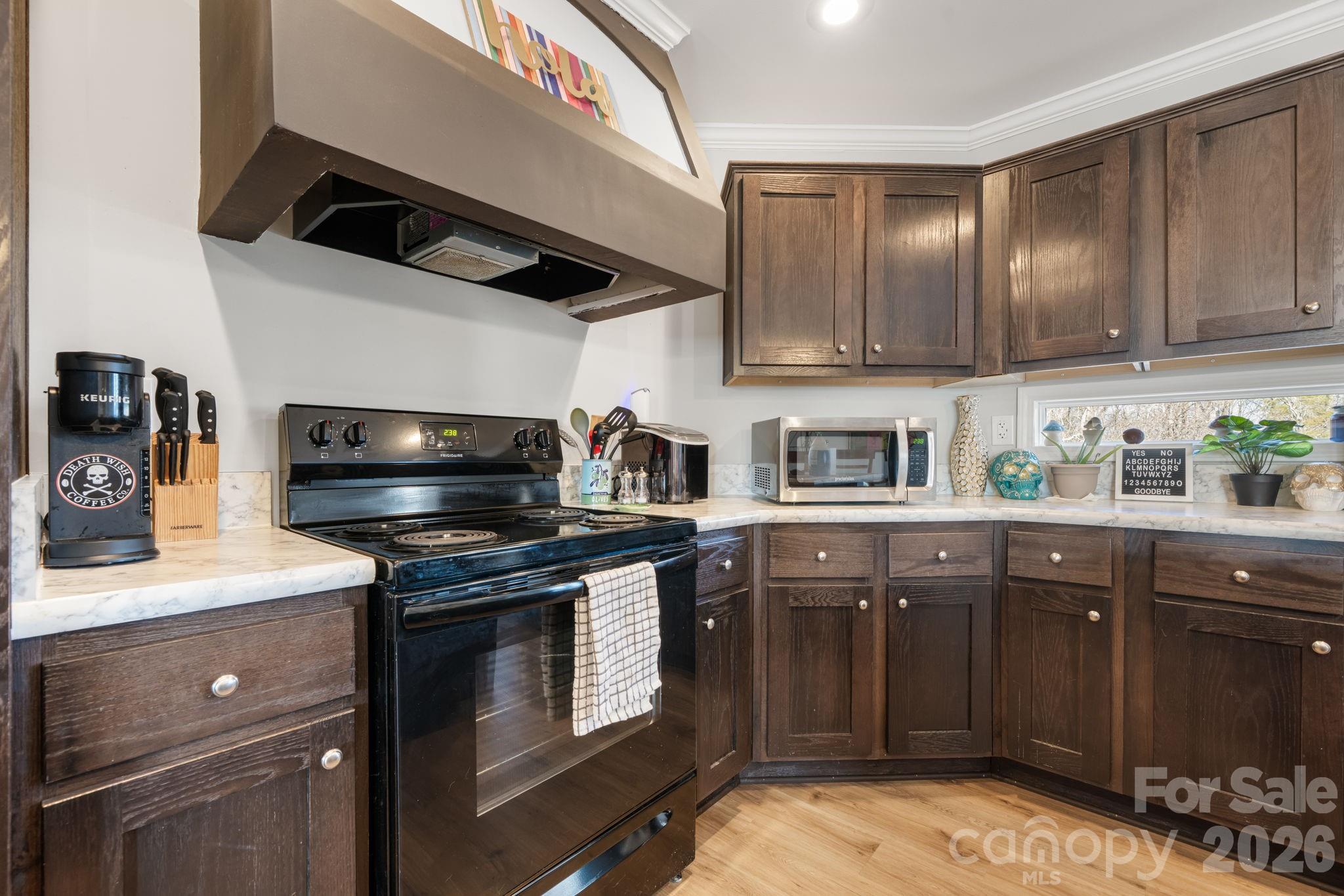 2388 Cat Square Road Vale, NC 28168 - Photo 6 of 24 a kitchen with stainless steel appliances granite countertop a sink a stove and cabinets