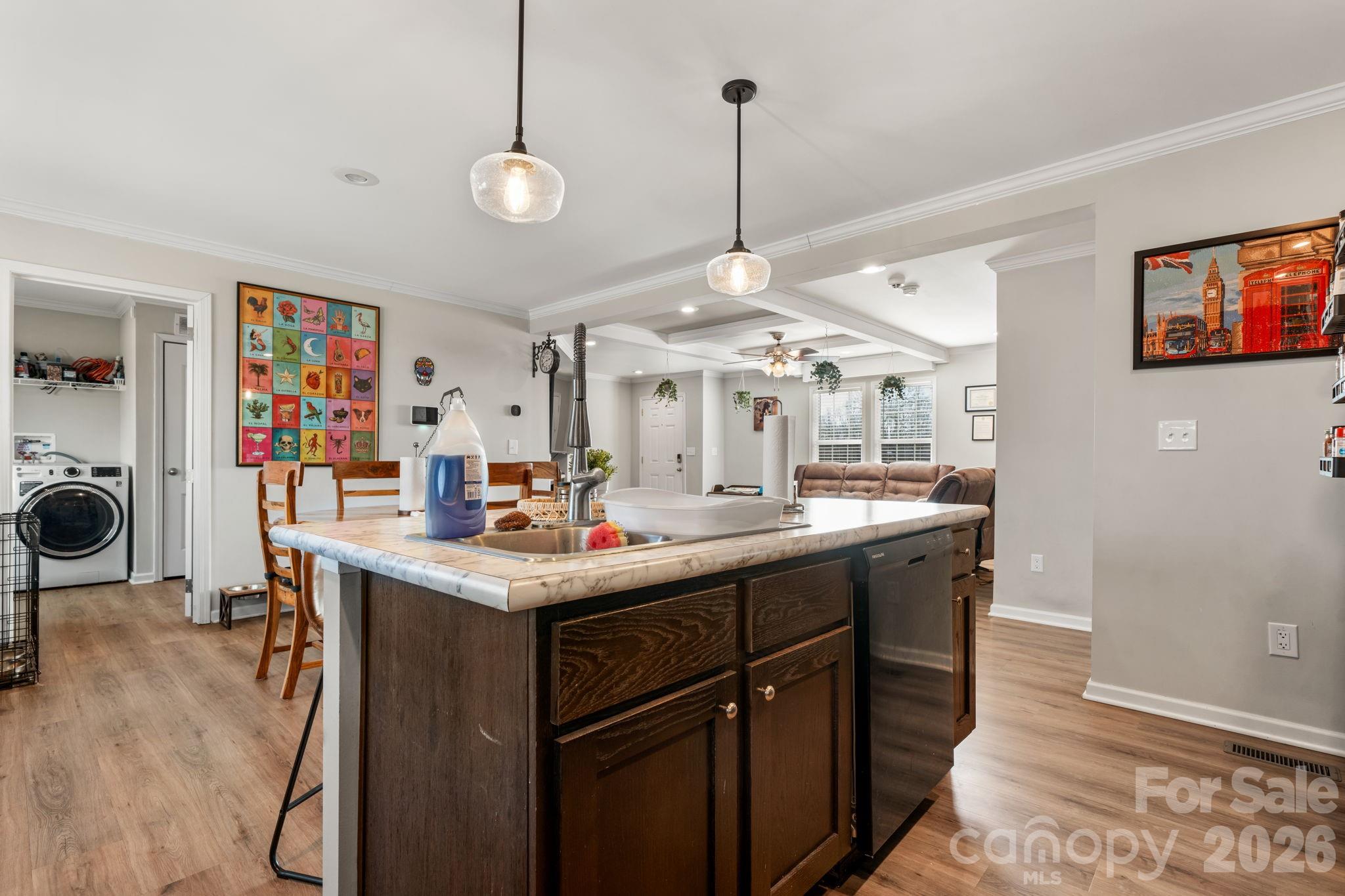 2388 Cat Square Road Vale, NC 28168 - Photo 7 of 24 a kitchen with stainless steel appliances granite countertop a stove a sink dishwasher and a wooden cabinets with wooden floor