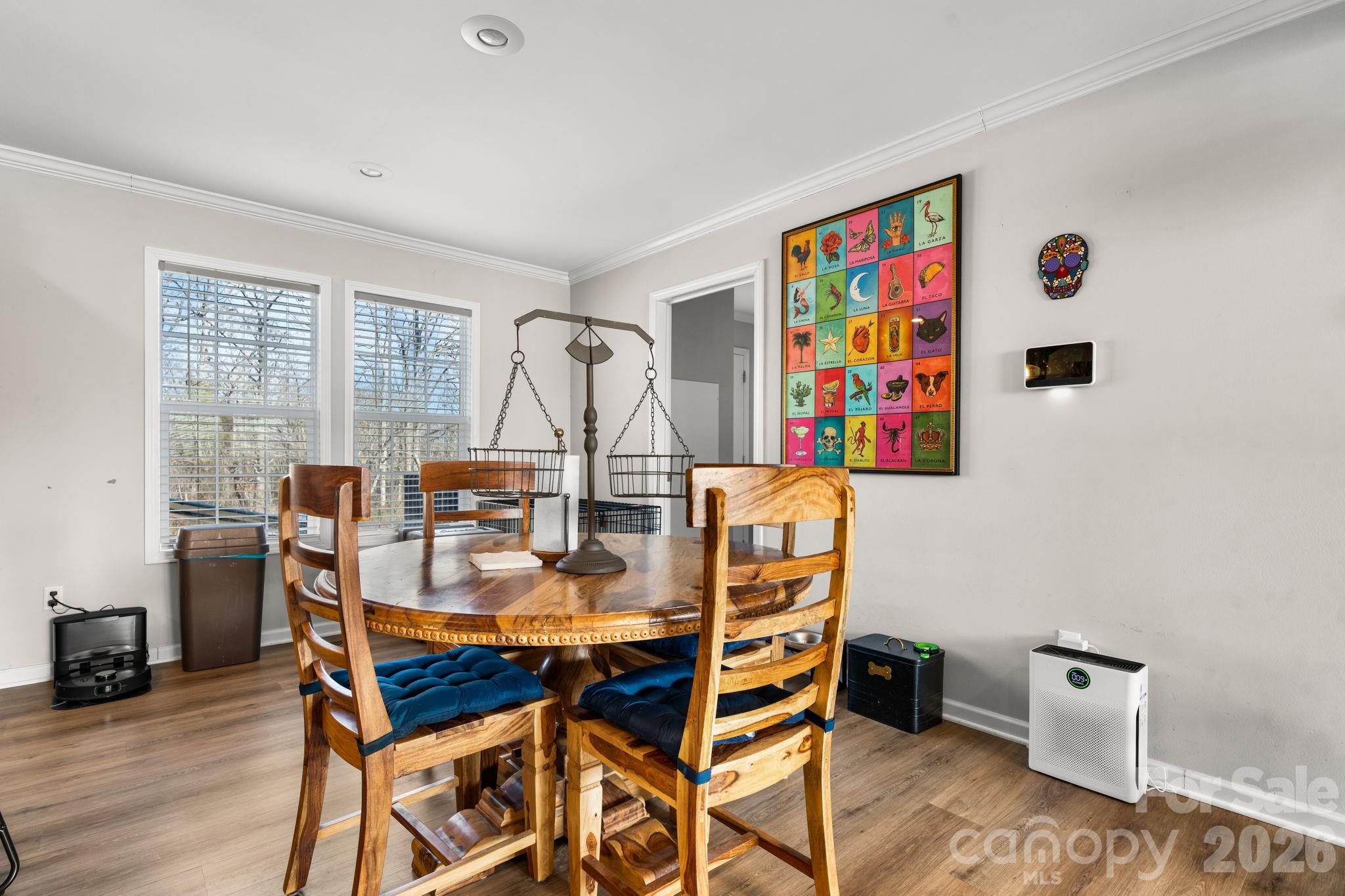 2388 Cat Square Road Vale, NC 28168 - Photo 8 of 24 a view of a dining room with furniture a rug and wooden floor