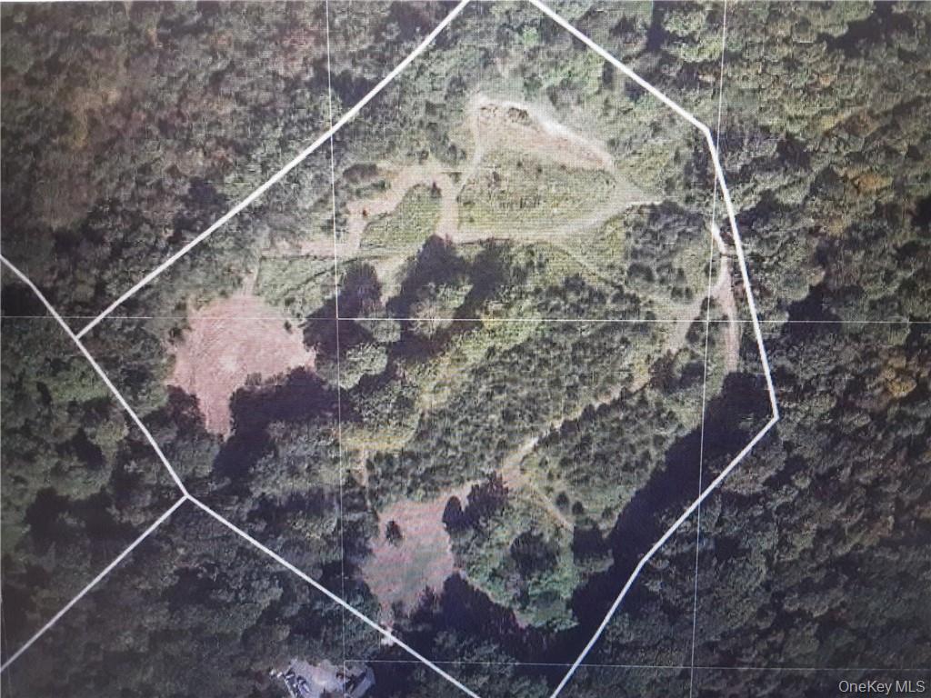 a water heater on a wooden floor