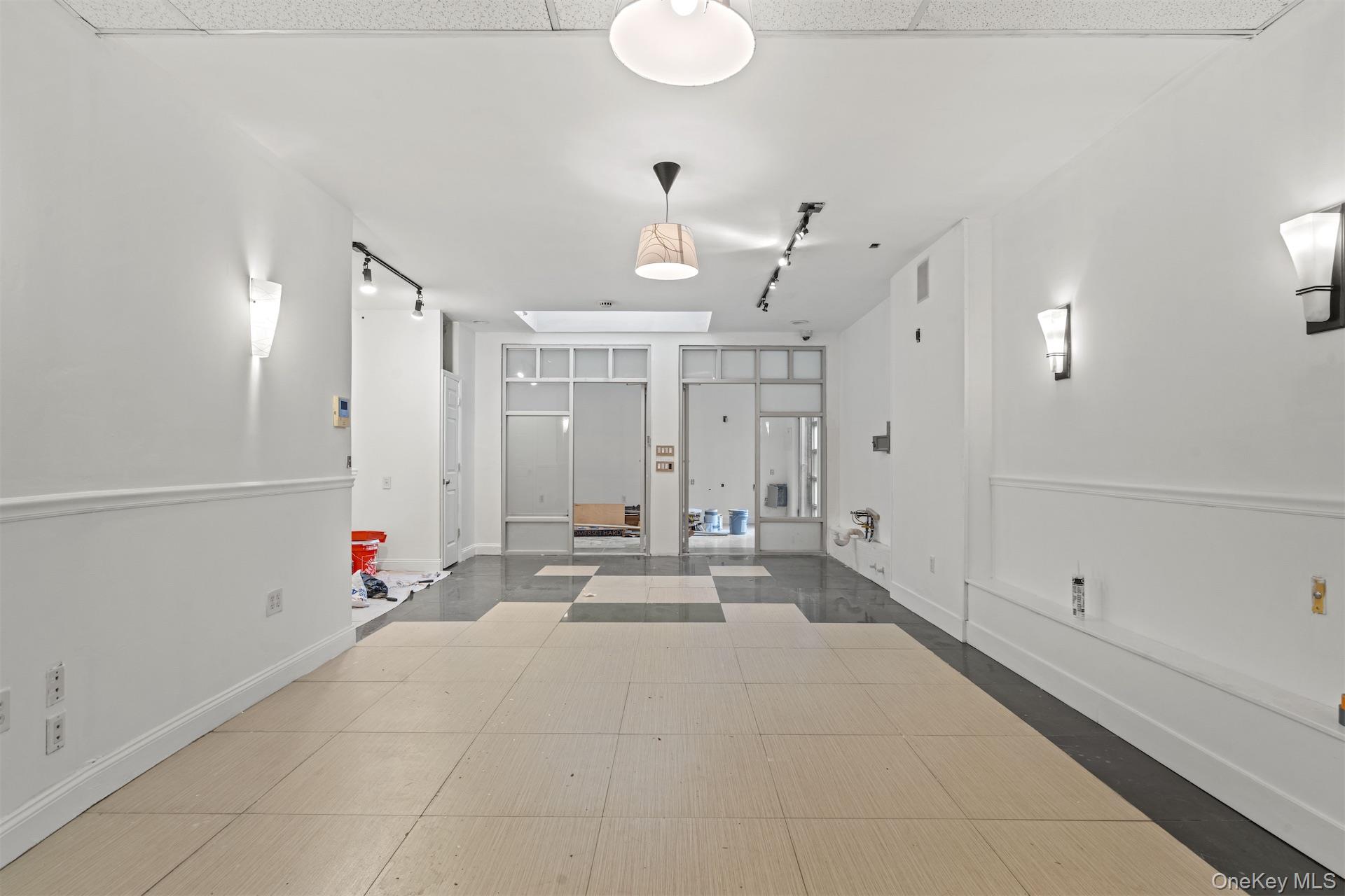 44-46 Decatur Street Brooklyn, NY 11216 - Photo 33 of 50 Corridor with track lighting and inlaid floor details
