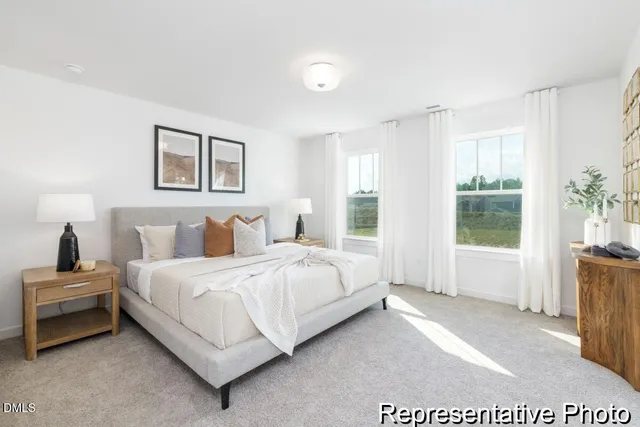 a bedroom with a bed and glass window