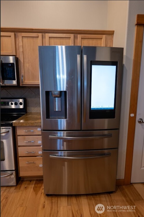 9723 Phillips Road Southeast Port Orchard, WA 98367 - Photo 11 of 37 a kitchen with appliances and cabinets
