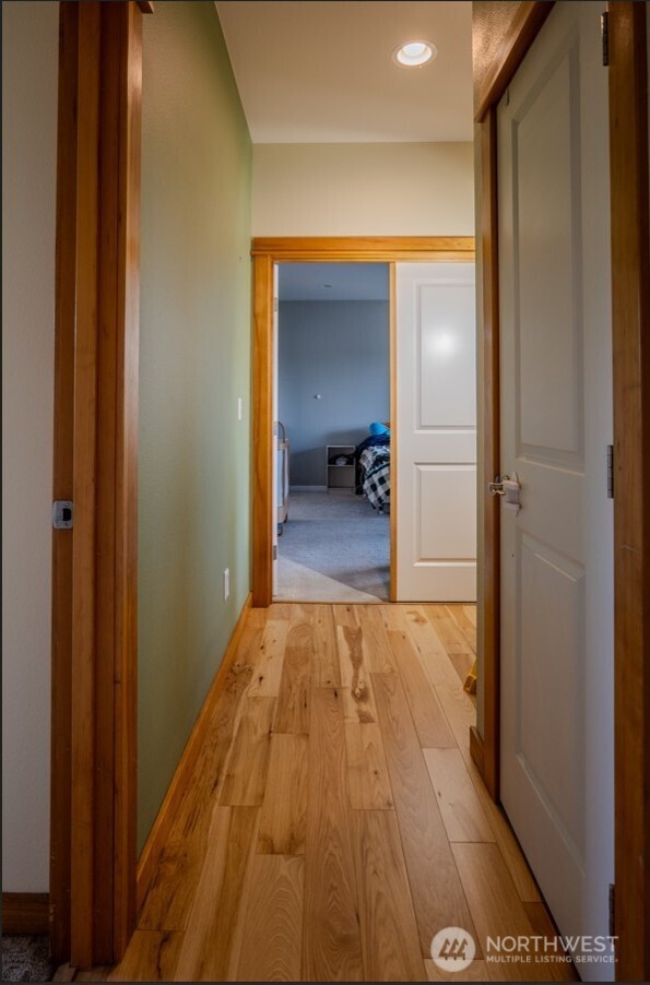 9723 Phillips Road Southeast Port Orchard, WA 98367 - Photo 13 of 37 a view of a bedroom from a hallway
