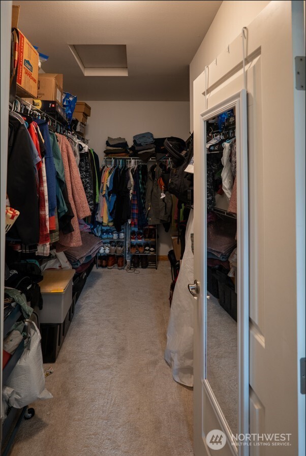 9723 Phillips Road Southeast Port Orchard, WA 98367 - Photo 19 of 37 a view of walk in closet with clothes and shoes