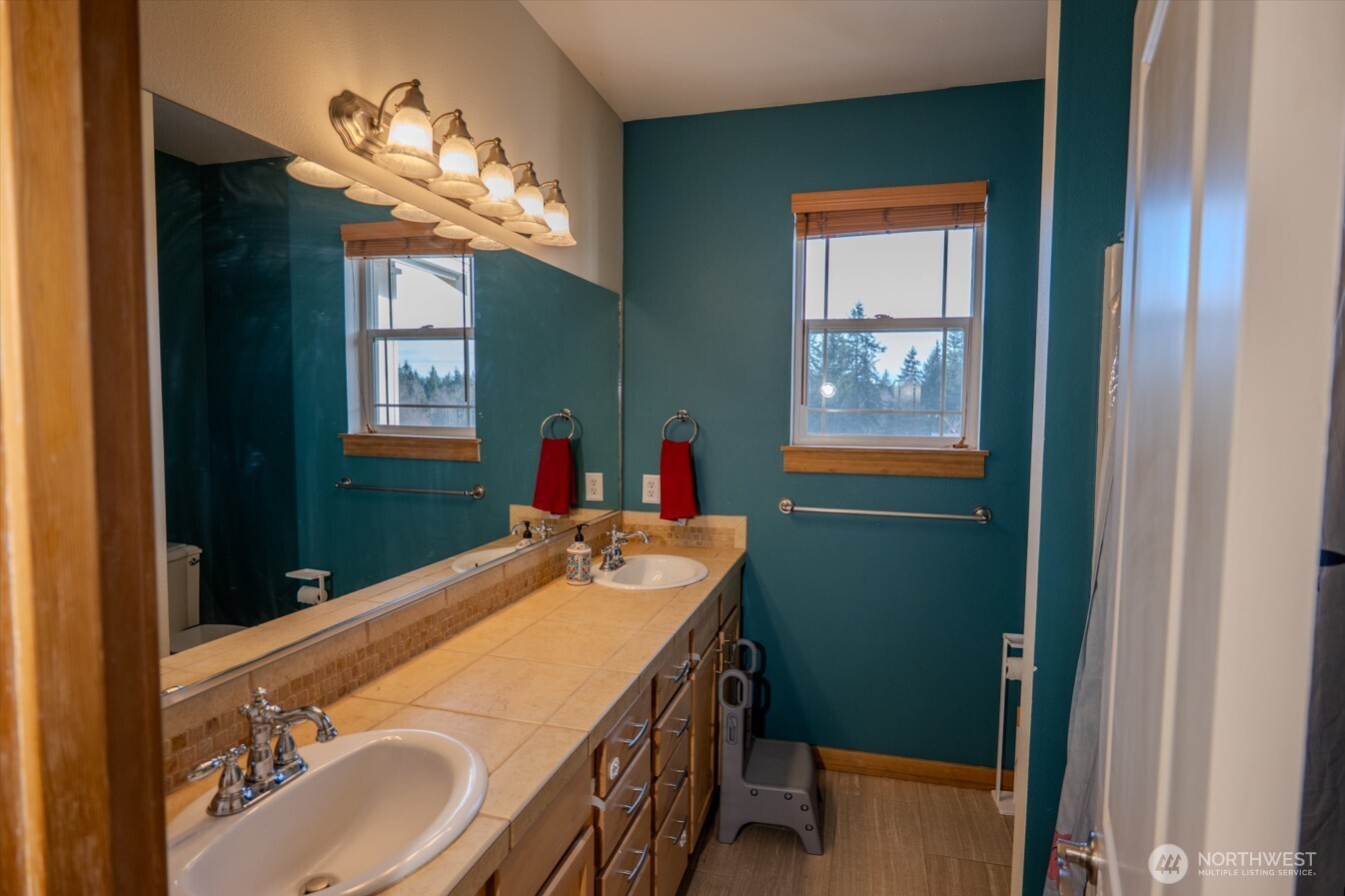 9723 Phillips Road Southeast Port Orchard, WA 98367 - Photo 24 of 37 a bathroom with a sink and a mirror