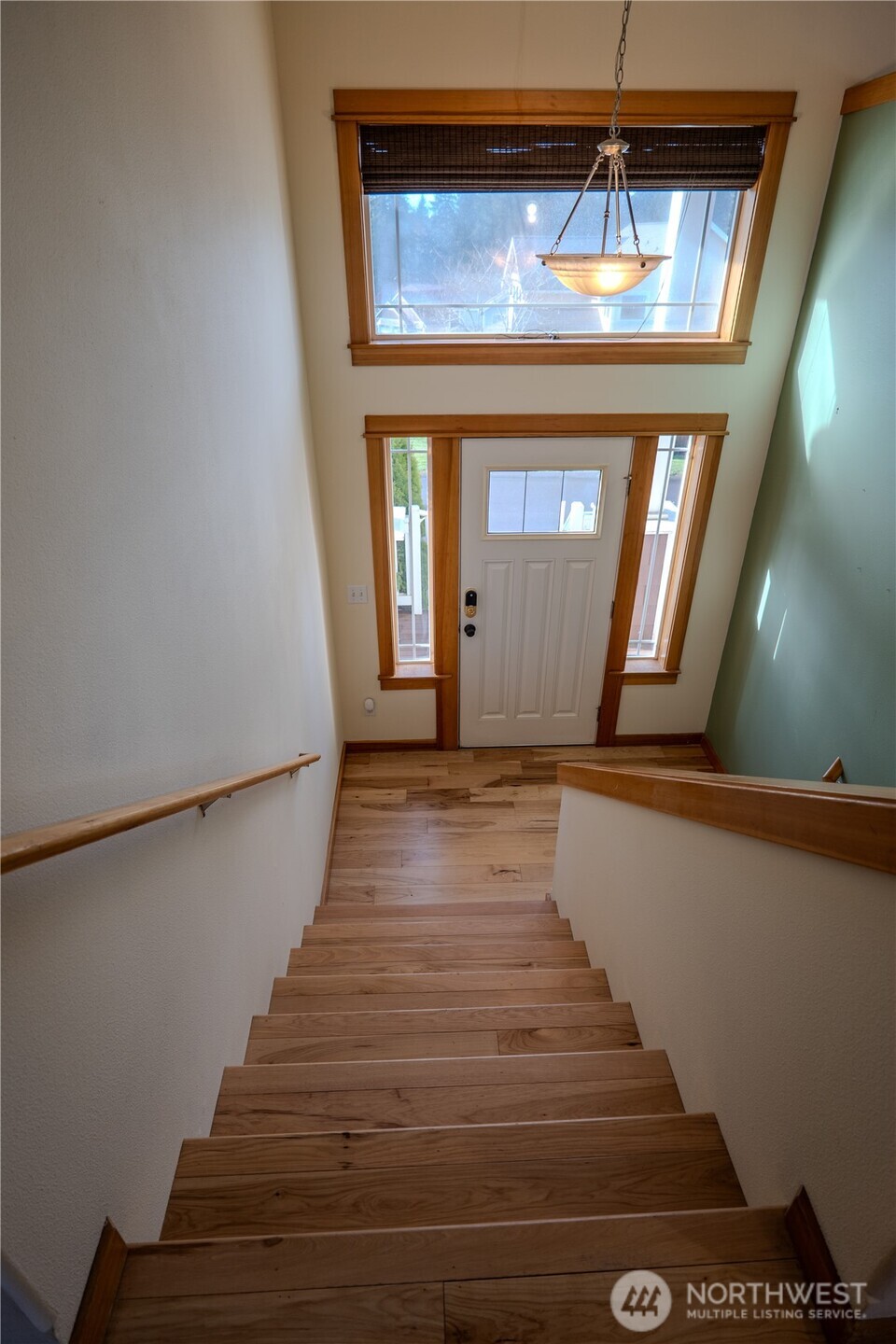 9723 Phillips Road Southeast Port Orchard, WA 98367 - Photo 25 of 37 a view of a hallway with wooden floor and staircase