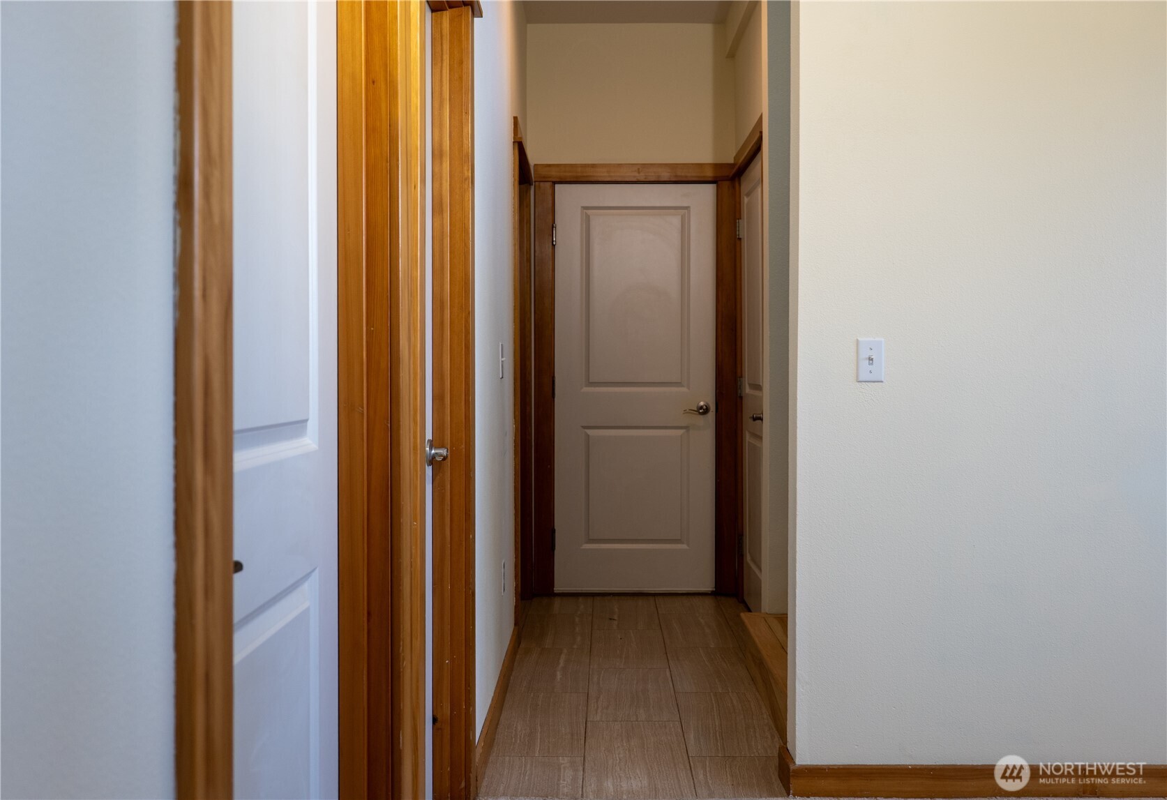 9723 Phillips Road Southeast Port Orchard, WA 98367 - Photo 30 of 37 a view of a hallway with wooden floor