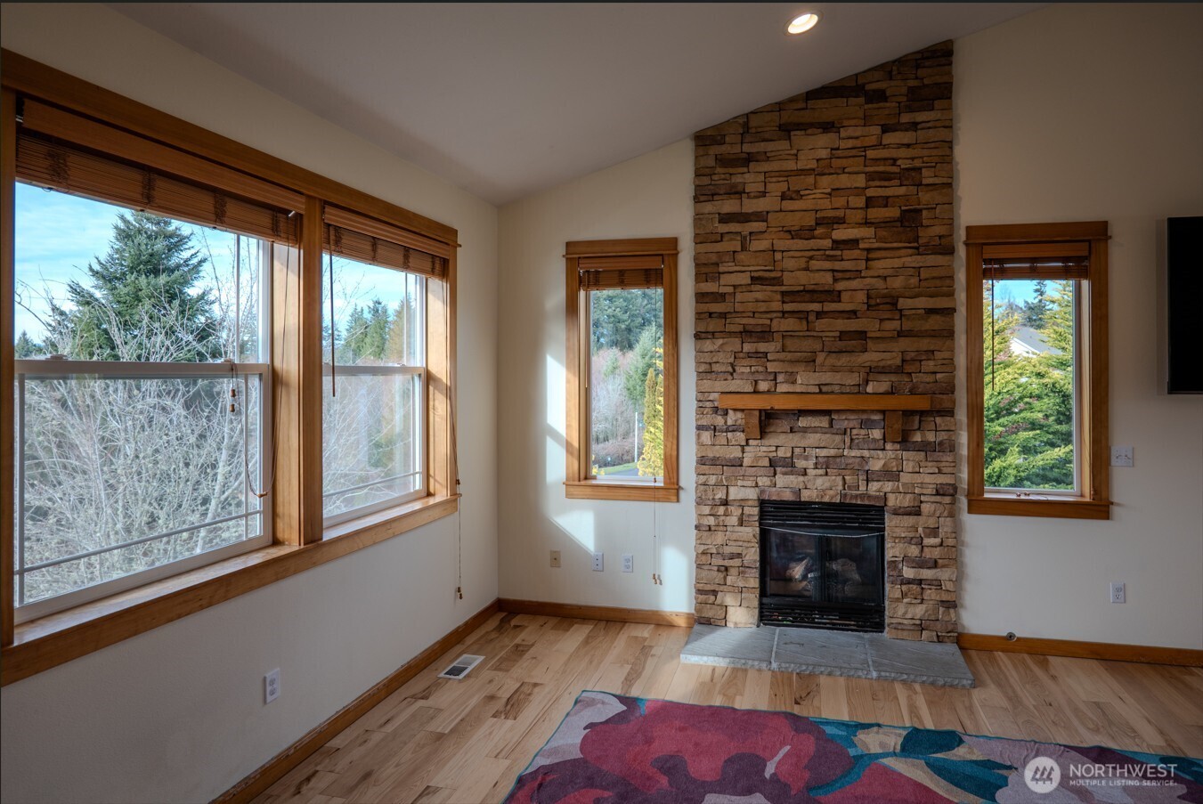 9723 Phillips Road Southeast Port Orchard, WA 98367 - Photo 3 of 37 an empty room with windows and fireplace